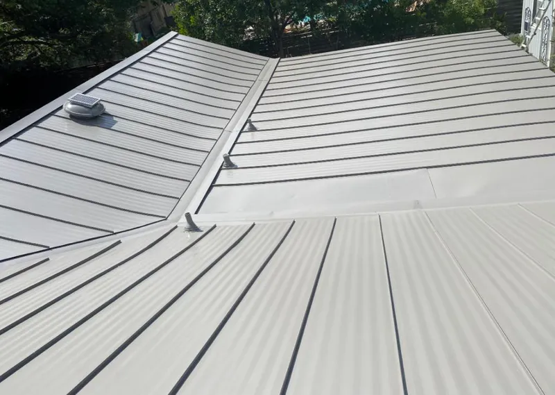 Solar attic fan installed on a metal roof for Roof Ventilation in Chalmette